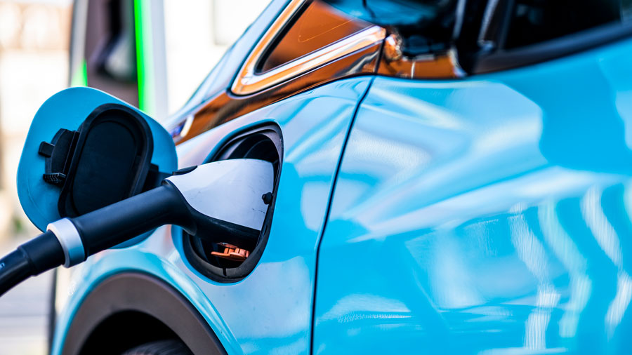 Blue EV on a charger