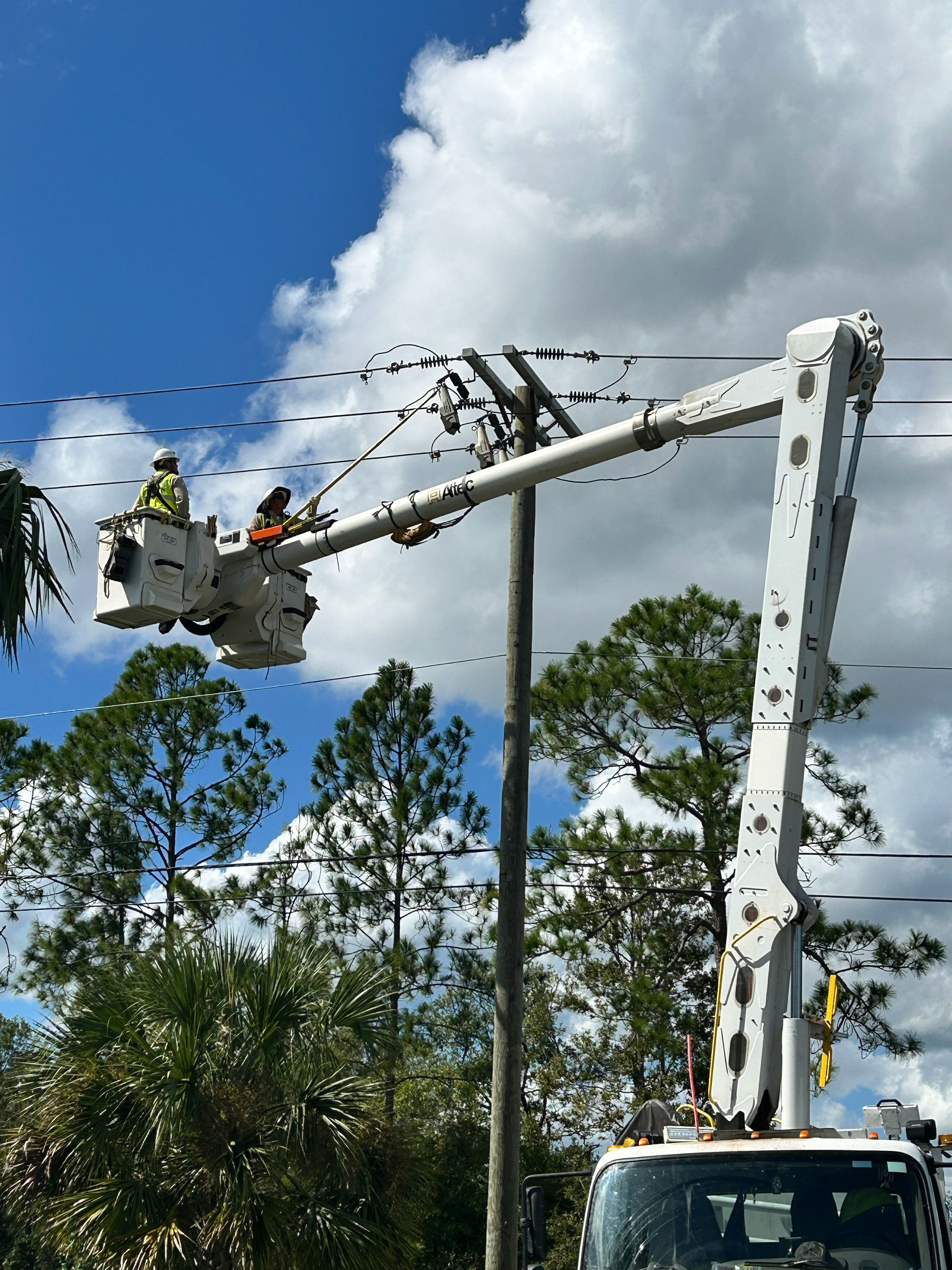 APS lineworkers in a bucket truck