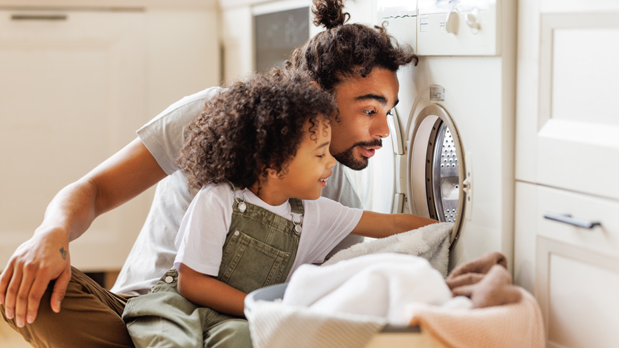 Woman adjusting her thermostat